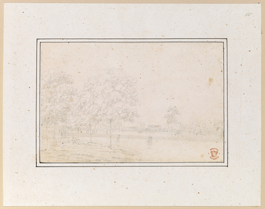 View of a park, and people walking along a path. There is a house in the background.