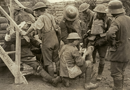 A British soldier has his wounds dressed in the field during the Battle of the Menin Road, near Zillebeke, Belgium, September 1917 (b/w photo)