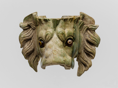 Lion's head protome with glass eyes, 1st century AD (bone and glass)