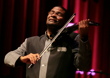 Omar Puente playing violin at Afro-Cuban Fiesta