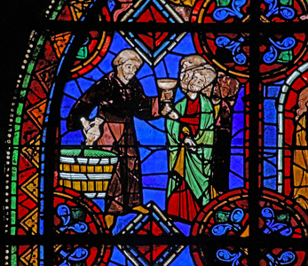Window w06 depicting Pilgrims at the tomb of St Julian of Brioude where wine is distributed (stained glass)