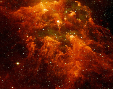 The "South Pillar" region of the star-forming region called the Carina Nebula. This murky cloud to reveal star embryos tucked inside thick dust. Spitzer Space Telescope.