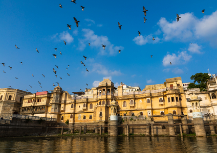 Historic building alongside lake Pichola, Rajasthan, Udaipur, India, 2019 (photo)