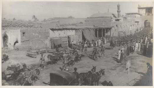 Indian troops and pack mule transport marching through New Street, Baghdad, 1917 (b/w photo)