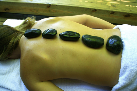 A massage treatment with hot stones. Intsomi Reserve, in Eastern Cape, South Africa. January 25, 2008.  (photo)