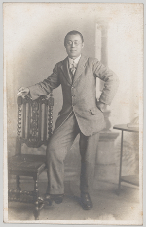 Studio portrait of a Chinese man in civilian dress, possibly a translator for 55th Company, Chinese Labour Corps, 1919 circa (b/w photo)