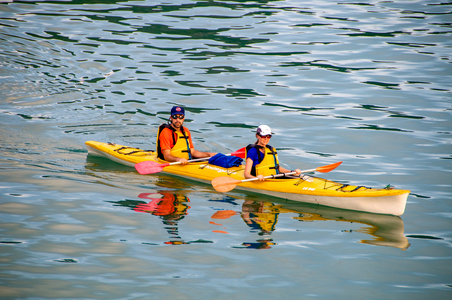 Vietnamese transport: Couple kayaking in Bai Tu Long Bay, Vietnam