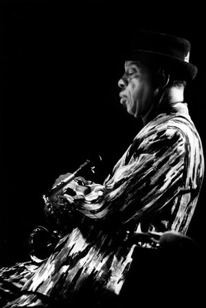 Ornette Coleman holding the