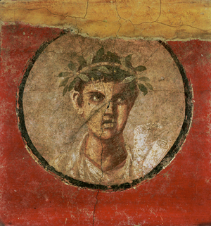 Medallion of an adolescent with rolls of parchment from Pompeii, Italy