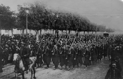 Prisoners of War Being Led in Front of Spectators, 1916 (b/w photo)