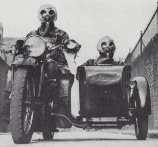 Police motorcycle and sidecar crew in Liverpool wearing gas masks as fears of impending war increased during the crisis over Czechoslovakia, September 1938 (b/w photo)