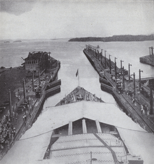American battleship passing through the Panama Canal on the day of its official opening, 15 August 1914 (b/w photo)