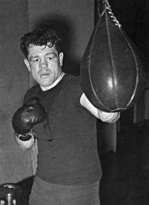 Adolf Heuser training at the punching bag, 1941 (b/w photo)