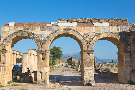Hierapolis, Denizli Province, Turkey.  Ruins of the ancient city.  The northern Roman Gate, also known as the Domitian Gate, or Domitian Arch, or the Frontinus Gate.  Hierapolis is a UNESCO World Heritage Site.