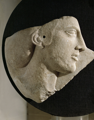 A woman's head. Relief. Fragment of a disk of Paros marble from Melos, Greece (marble relief)