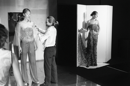 Designers working long hours in Armani's Milan studio preparing for a forthcoming show, 17/07/2001 (b/w photo)