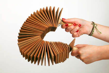 Kokorico or Binsasara, collection of wooden slats with handles at either end, Being played