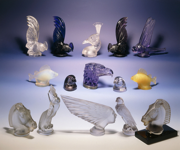 Various glass car mascots (of birds, fish, horses and a human head),  (in clear, satin-finished, opalescent, topaz, amethyst and amber)