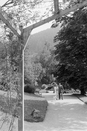 Relaxing at the public gardens of a small town, Germany 1930s (b/w photo)