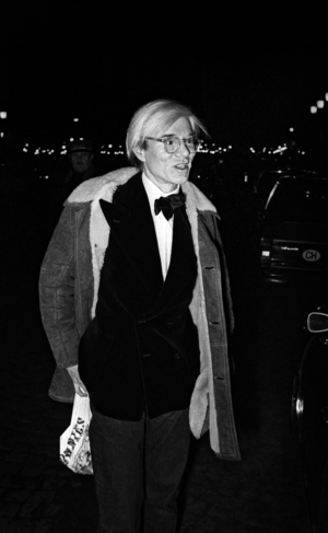 Andy Warhol leaving Maxim's Restaurant after the party for Liza Minelli, Paris, 26 November, 1973 (b/w photo)