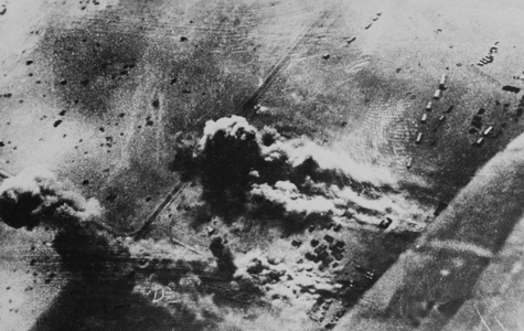 German bombing of Allied motorized units in Tobruk 1941 (b/w photo)