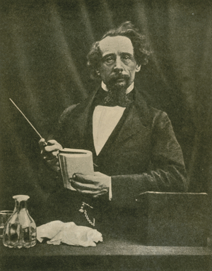 Charles Dickens, giving a reading, 1859 (b/w photo)