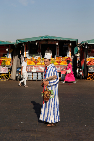 Man standing on Jemaa El Fna square, Marrakesh, Morocco (photo)