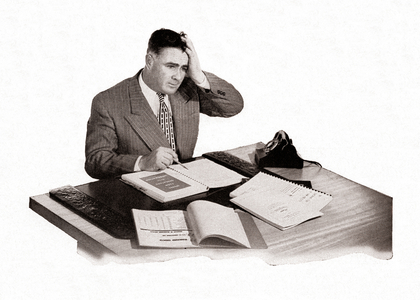 Stressed Office Worker at His Desk Getting a Headache, 1951 (screenprint)