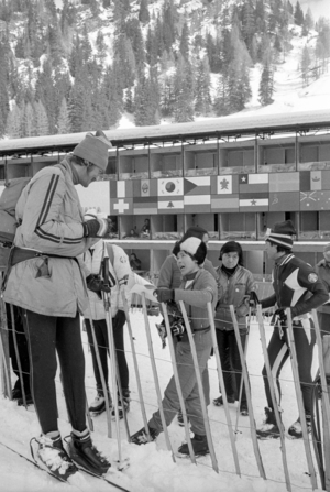 Japanese skiers talking to a journalist, 1970 (b/w photo)