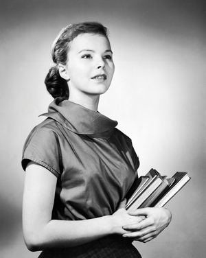 Teenage girl holding books
