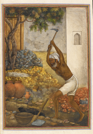 A labourer wielding a pick.