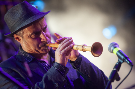 Ambrogio Sparagna's Popular Orchestra fife player performing at Carpino Folk Festival, Puglia, Italy, 2014 (photo)