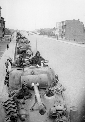 A column of Sherman tanks from 3rd/4th County of London Yeomanry, Belgium, 1944 (b/w photo)