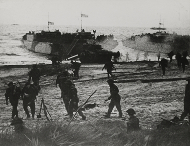 Landing craft and soldiers coming ashore at Ouistreham or Bernieres, St Aubin sector, 6th June 1944 (b/w photo)