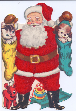 A die-cut Xmas Card of Father Christmas holding stockings with a kitten and puppy in them, his costume covered with red flocking, circa 1910 (coloured lithograph)