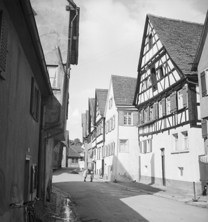 On the way through German landscape and small town, Germany 1930s (b/w photo)