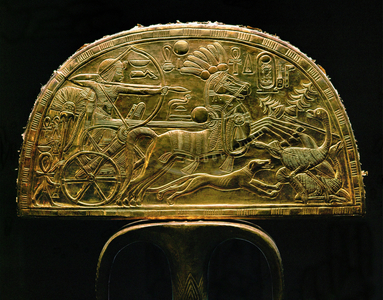 Tutankhamun on a chariot aiming his arrow at an ostrich (gold, metal and wood)