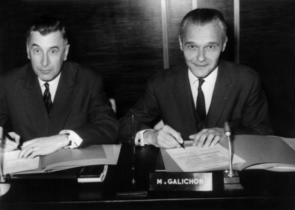 Jean Ravanel Commissioner for Tourism (Left) And Mr Georges Galichon President of Air France Signing the Cooperation Agreement November 23, 1967 At Air France Headquarters (b/w photo)