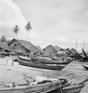 Boats and huts, Pangor Island, Malaya, 1938 (b/w photo)