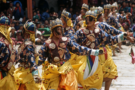 Bell dancers at the Paro Tshechu, mask dance festival, in the Paro Dzong, Bhutan (photo)