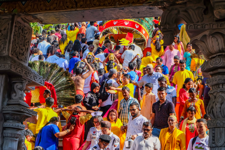 Thaipusam Festival: Devotees climbing steps to and from the Batu Caves, Kuala Lumpur, Malaysia