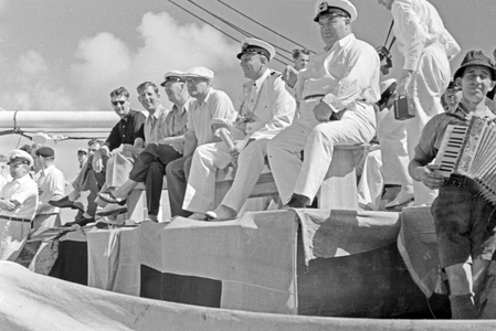 The captain of the factory vessel "Jan Wellem", Otto Kraul, watching the crossing-the-line-ceremony, prepared by his crew, 1930s (b/w photo)