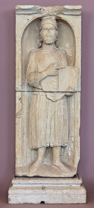 Man holding a book, Sculpture 12th century (sculpture)