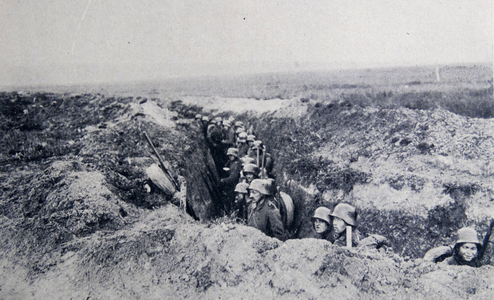 German World war one soldiers under fire, in a trench