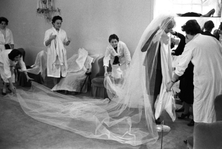 Rome, Italy, 1960, The actress Virna Lisi in the workshop of Mingolini Guggenheim for the rehearsal of the wedding dress (b/w photo)