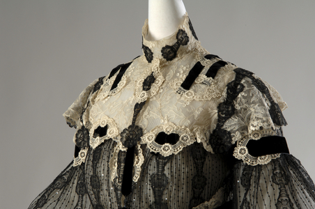 Evening dress, 1902 (partial front oblique view), Silk lace, silk net, sequins, glass beads, silk velvet trim, Henriette Favre, Paris