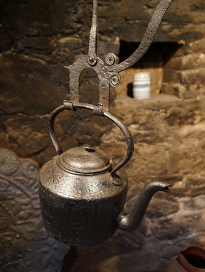 Large hanging kettle over the Kitchen hearth inside Anne Hathaway's Cottage