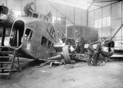 Dismantling of a German airplane, 1922 (b/w photo)