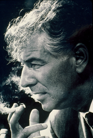 American composer Leonard Bernstein smoking a cigarette (photo)