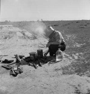 Refugee from the Dust Bowl stops by the side of the highway, California, 1937 (b/w photo)